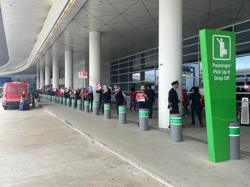 Flight attendants picket outside Dallas-Fort Worth International Airport on Thursday, May 9, 2024.