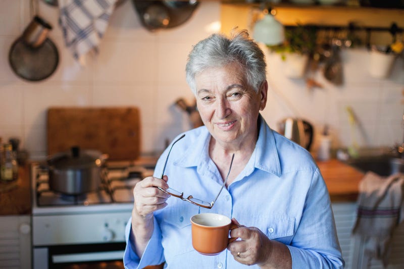 grandma in kitchen with coffee