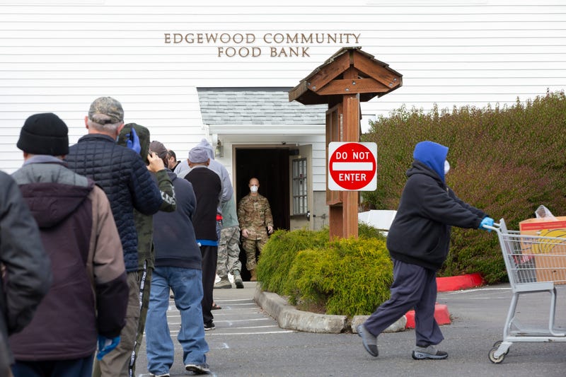 People wait in line outside Washington state food bank