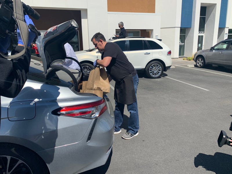 Volunteers Load Bags Of Food To Promote New "Delivery With Dignity" Service On 3-23-20