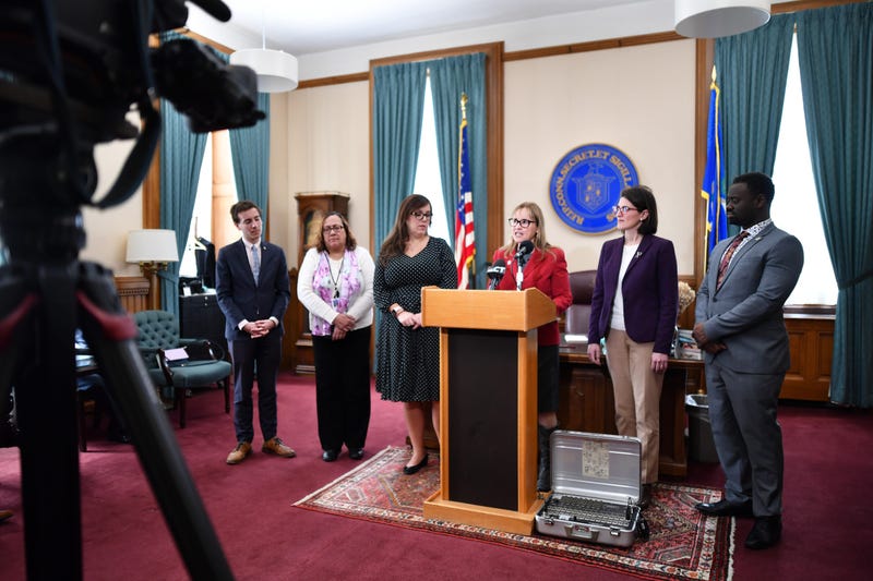 Secretary of the State Denise Merrill announces election legislative proposal at the Capitol.