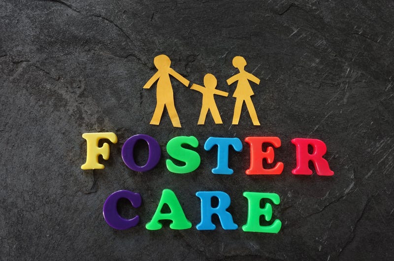 Paper family with foster care letters