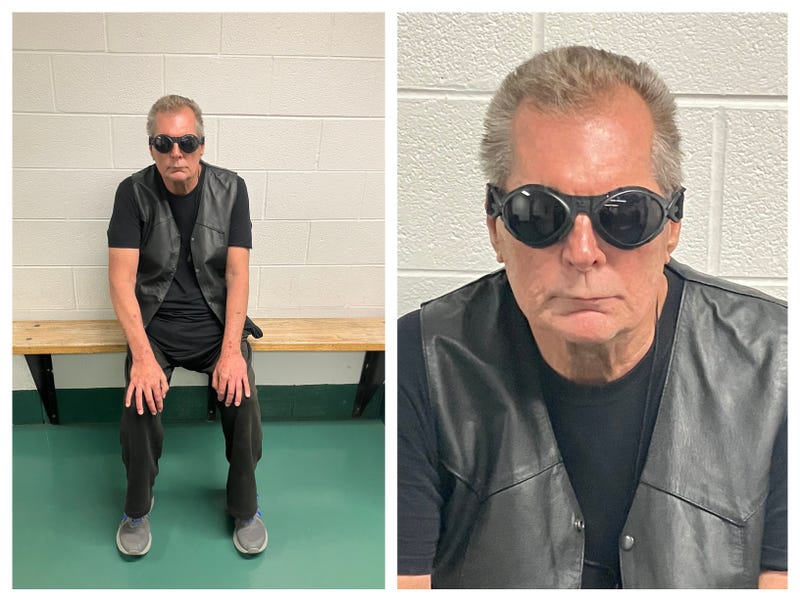 Photo of man found wandering near I-75 and 14 Mile Road. Wearing all black with gray tennis shoes and thick, blacked-out glasses or goggles.