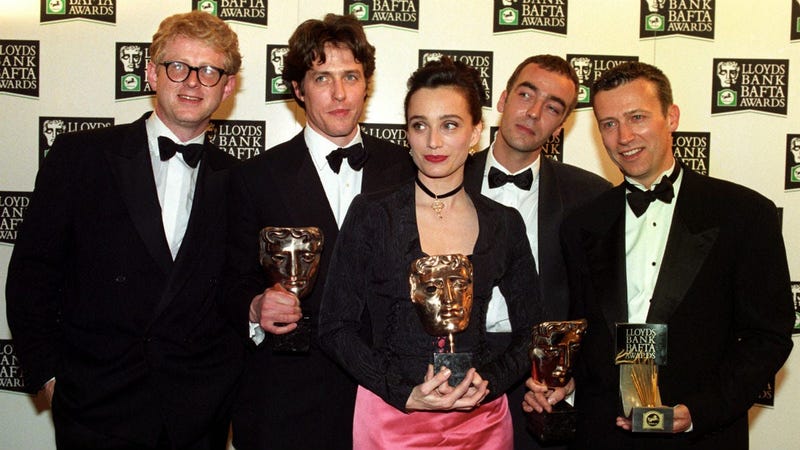 The cast of "Four Weddings and a Funeral" celebrates its British Academy Film Awards win in 1994 in London.The cast has reunited for a short sequel that will air as part of Red Nose Day on May 23 on NBC.