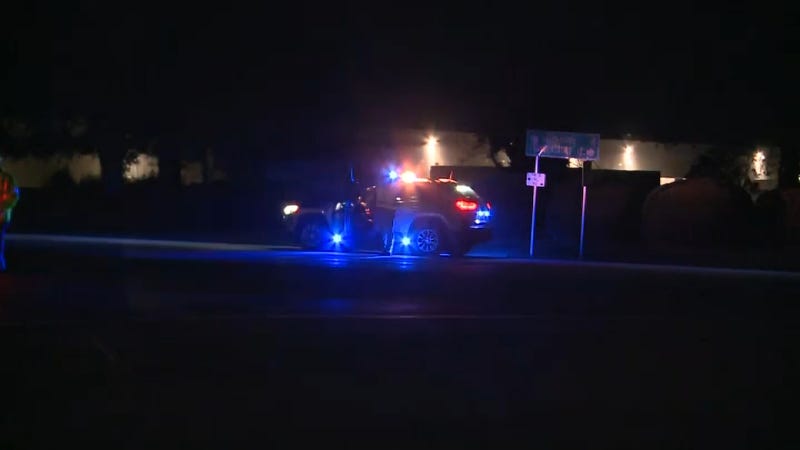 Police vehicle on the scene after a gunfight that wounded two state troopers and killed one suspect.