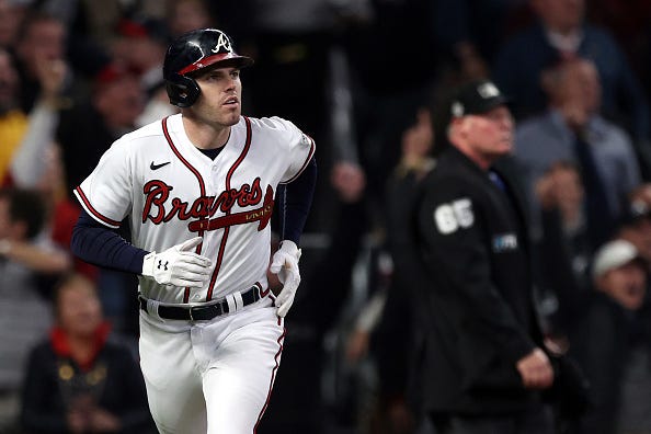Freddie Freeman heads to first as he watches a deep drive