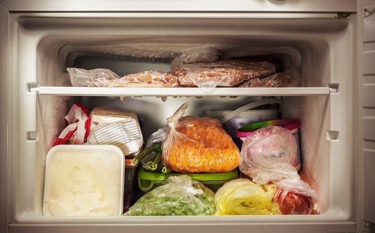 multiple different frozen foods in a freezer