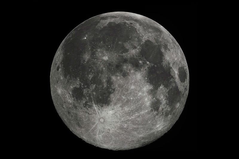 Full Moon in the darkness of the night sky.