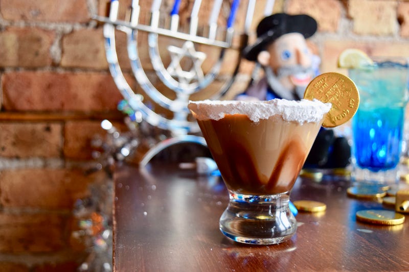 This week's Cocktail of the Week is a Gelt Martini, has been brought to us by our friends at 8 Crazy Nights/Graystone Tavern. It was created by the owner Sam Stone to be featured on the 8 Crazy Nights Hanukkah pop-up bar speciality menu.