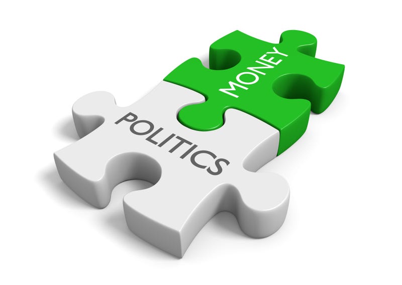 Two connected puzzle pieces with the words politics and money