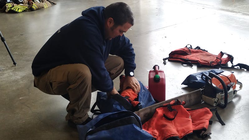 A Fort Worth firefighter prepares to help fight the Eastland Complex wildfire on Friday, March 18, 2022.