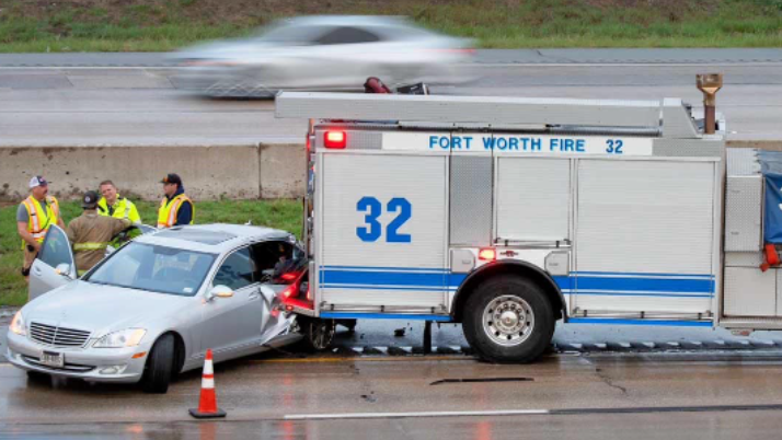 Driver skids on wet pavement, crashing into Fort Worth fire truck