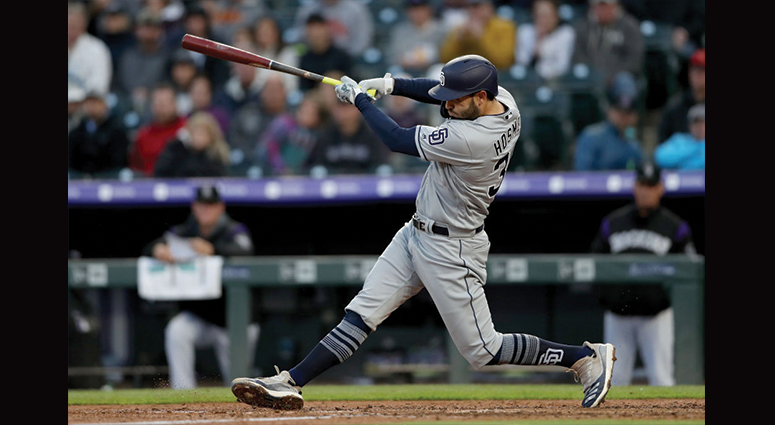 MAY 11: Eric Hosmer #30 of the San Diego Padres hits a RBI single in the sixth inning against the Colorado Rockies at Coors Field on May 11, 2019 in Denver, Colorado. (Photo by Matthew Stockman/Getty Images)