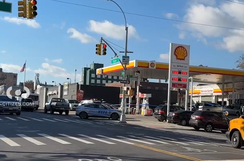 Police investigate after two men were stabbed in an attempted robbery outside a gas station in Sunset Park.