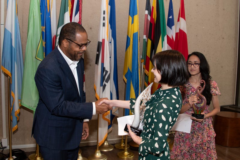 Mayor Eric Johnson presenting the award to Dr. Mag Gabbert
