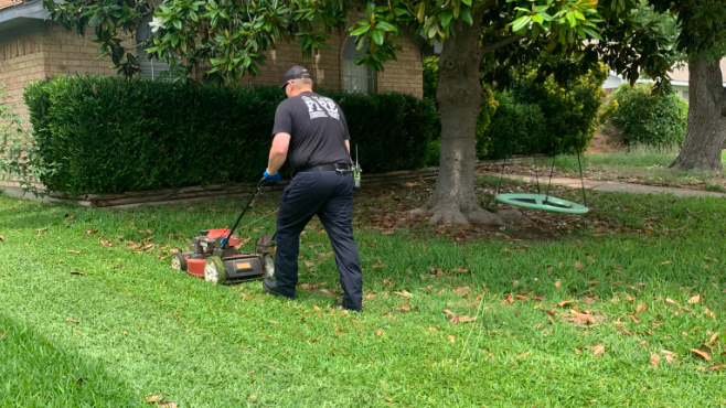 Garland fire crew finishes mowing the lawn of a heart attack victim