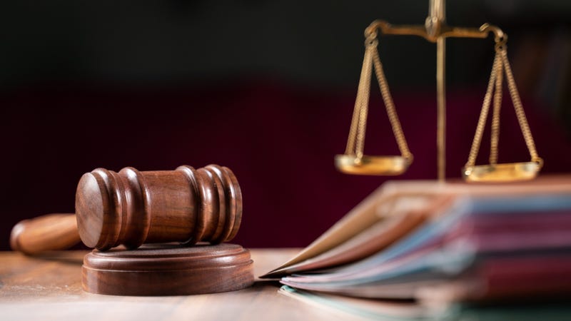 Gavel and file folders in judge/court setting