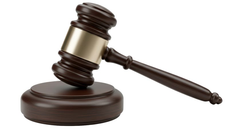 Wooden gavel on sounding block for legal proceedings - stock photo