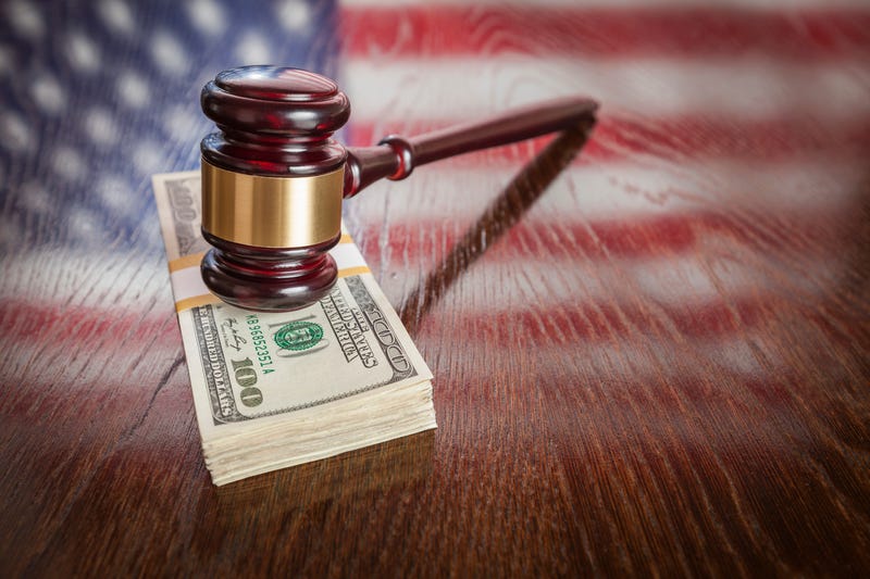 Gavel on top of money