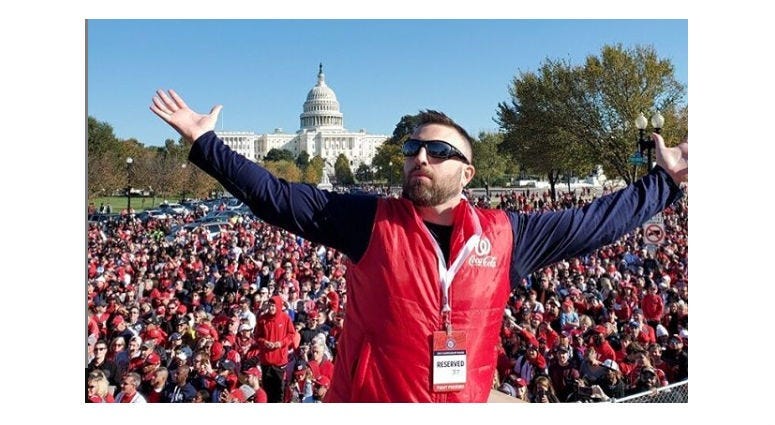 Grant Paulsen and Danny Rouhier of the "Grant & Danny Show" take part in the Washington Nationals victory parade in Washington, D.C. on Saturday, November 1.