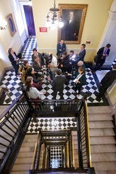 Virginia Gov. Ralph Northam, center back to camera, talks to the media after he outlined his legislative agenda at the Capitol in Richmond, Va., Tuesday, Jan. 7, 2020. (AP Photo/Steve Helber)