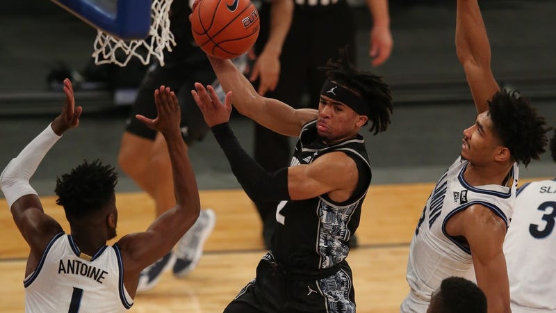 Georgetown Hoyas guard Dante Harris (2) drives to the basket against Villanova Wildcats guard Bryan Antoine (1) and forward Jermaine Samuels (23) during the first half of a Big East tournament game at Madison Square Garden.
