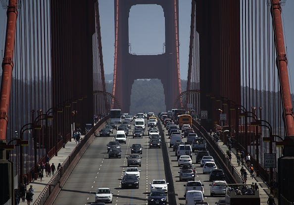 Cars drive over the Golden Gate Bridge