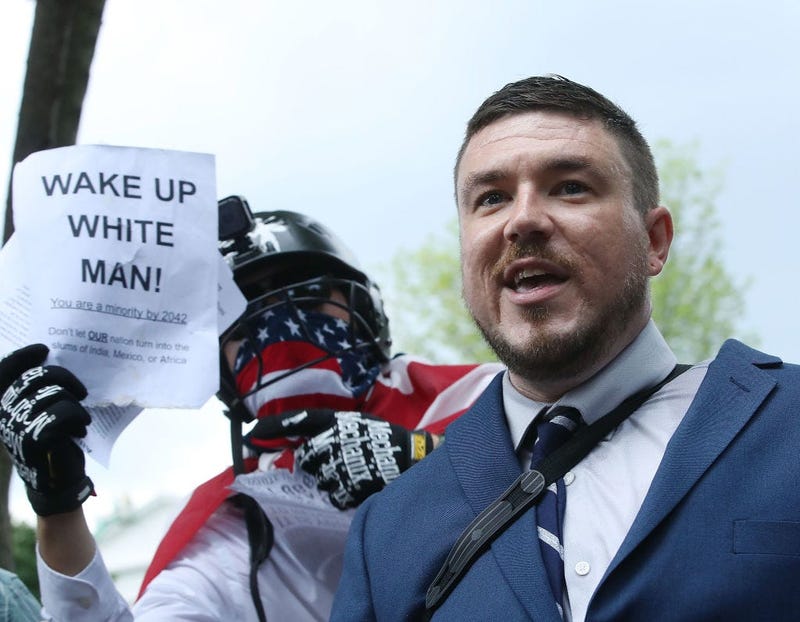 Jason Kessler (C), who organized the rally, speaks as white supremacists, neo-Nazis, members of the Ku Klux Klan and other hate groups gather for the Unite the Right rally in Lafayette Park across from the White House August 12, 2018 in Washington, DC.