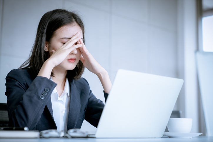 A woman feeling stressed. 