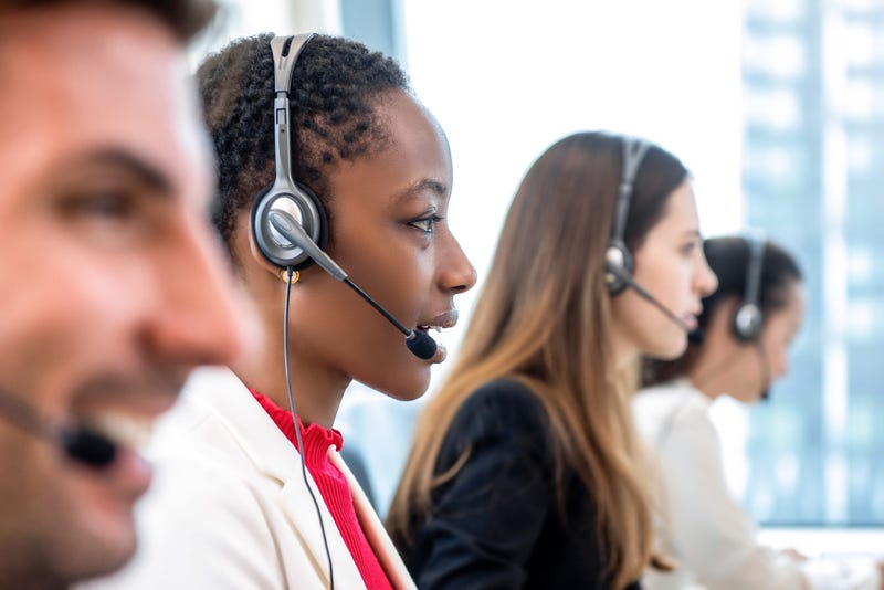 Telemarketers answering phones at a call center