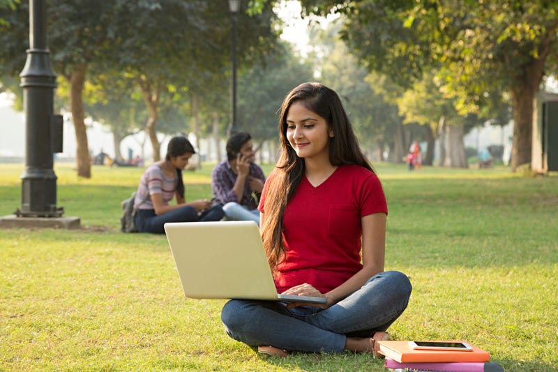 Young female student studying on campus