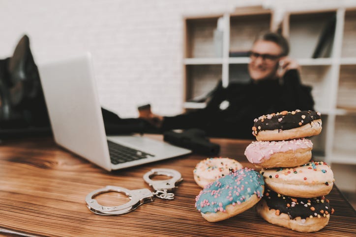 Police Officer with doughnuts