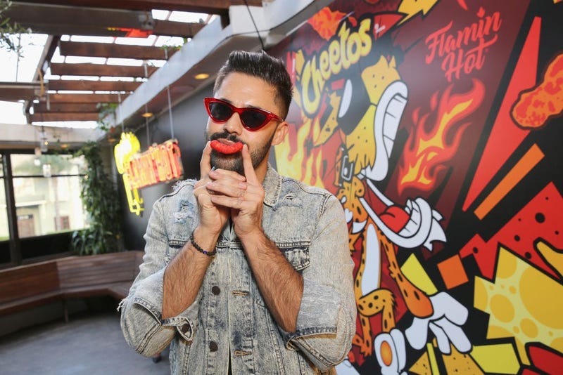 Guy uses a flamin' hot Cheeto puff as a mustache
