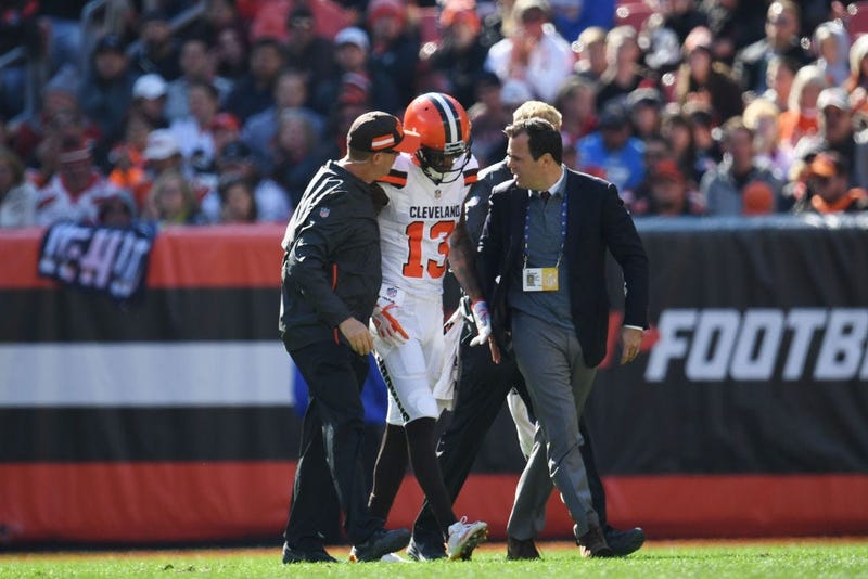 CLEVELAND, OH - OCTOBER 14: Rod Streater #13 of the Cleveland Browns is escorted offsides the field by medical staff in the first quarter against the Los Angeles Chargers at FirstEnergy Stadium on October 14, 2018 in Cleveland, Ohio.