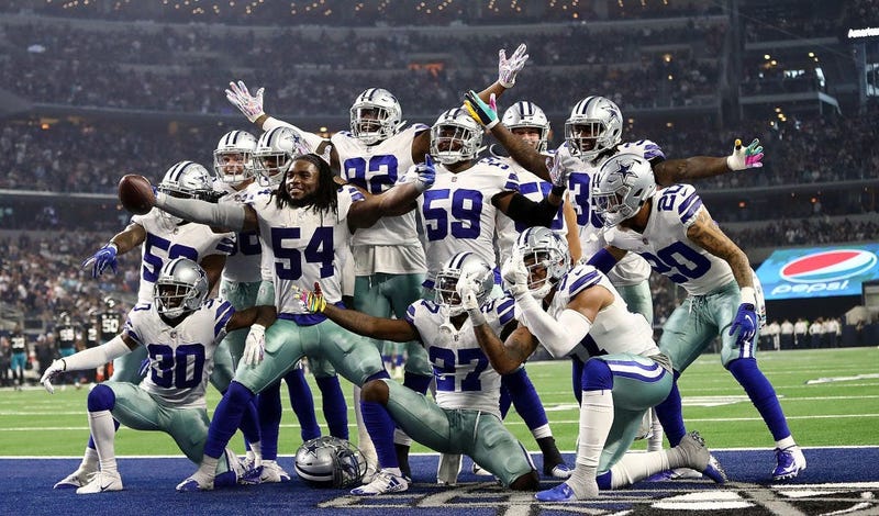 Jaylon Smith #54 and the Dallas Cowboys defense celebrate a fumble recovery against the Jacksonville Jaguars at AT&T Stadium on October 14, 2018 in Arlington, Texas.