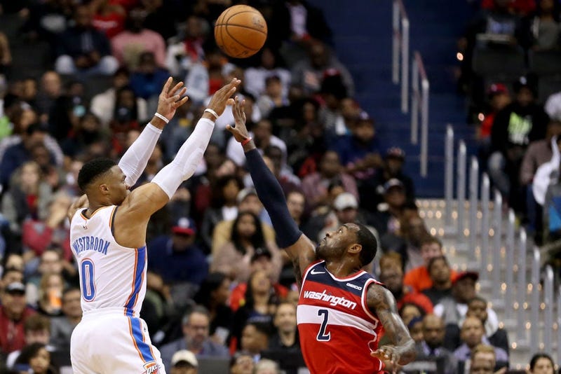 Russell Westbrook #0 of the Oklahoma City Thunder shoots over John Wall #2 of the Washington Wizards during the second half at Capital One Arena on November 2, 2018 in Washington, DC. 