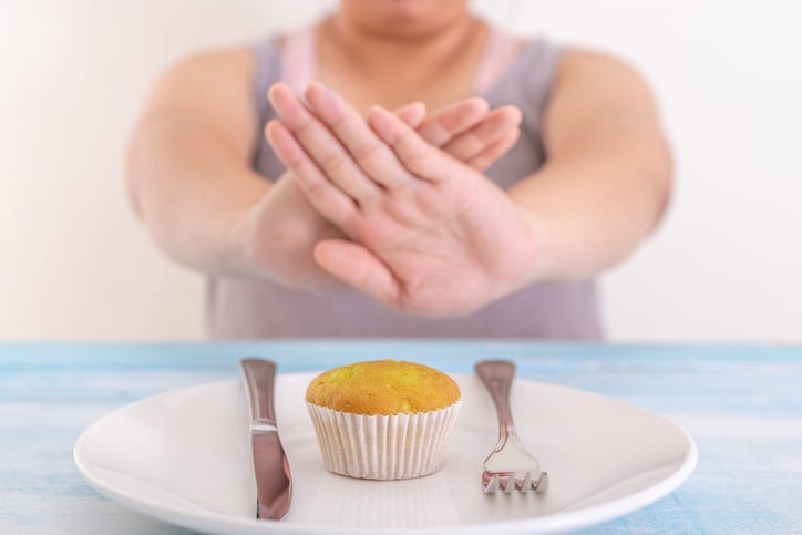 woman avoiding food