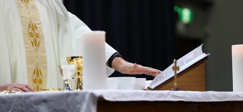 Detail of a catholic priest serving mass at a liturgy.