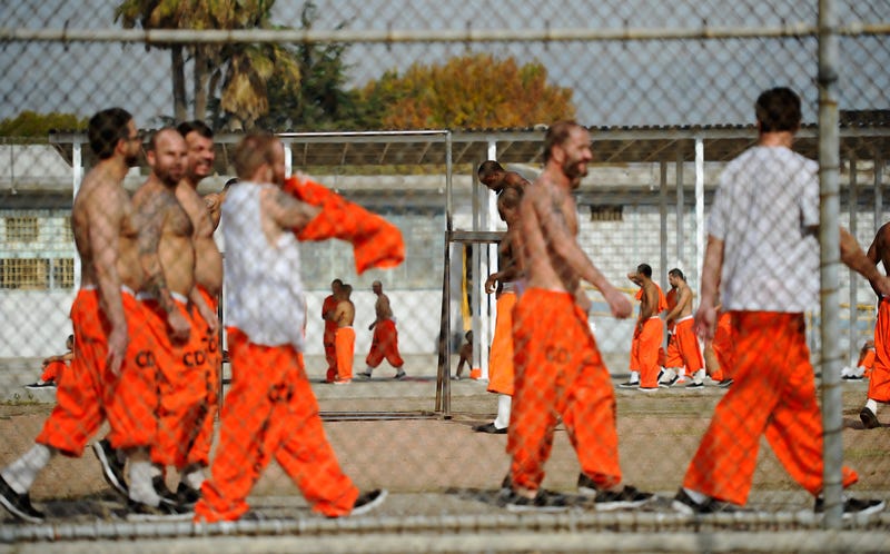Inmates at Chino State Prison exercise in the yard December 10, 2010 in Chino.