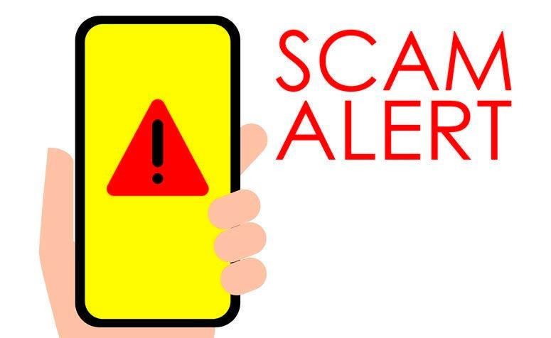 Illustration of Scam Alert Hand holding a mobile phone with scam alert sign