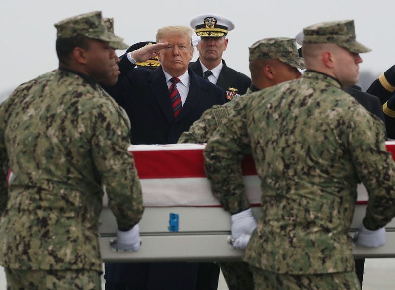 President Trump salutes the coffin of Scott Wirtz