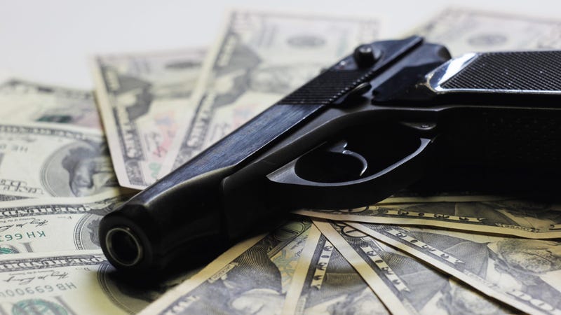 Pistol and money as sign of criminal activity