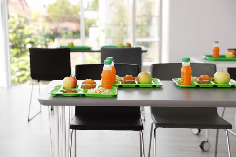 Trays with healthy food on table
