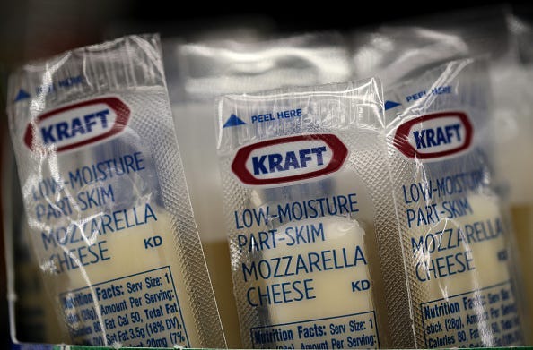 Packages of Kraft mozzarella cheese are displayed on a grocery store shelf on February 22, 2019