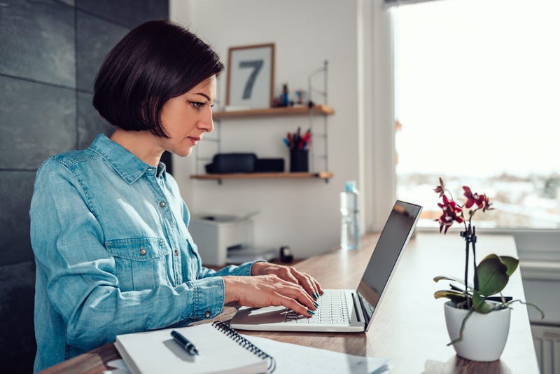 Woman using laptop in the office