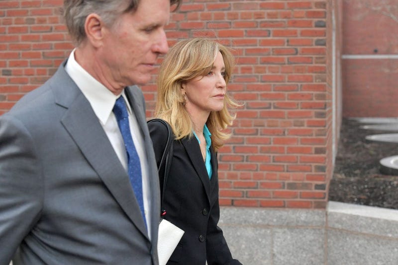 Felicity Huffman exits the John Joseph Moakley U.S. Courthouse after appearing in Federal Court to answer charges stemming from college admissions scandal on April 3, 2019 in Boston, Massachusetts