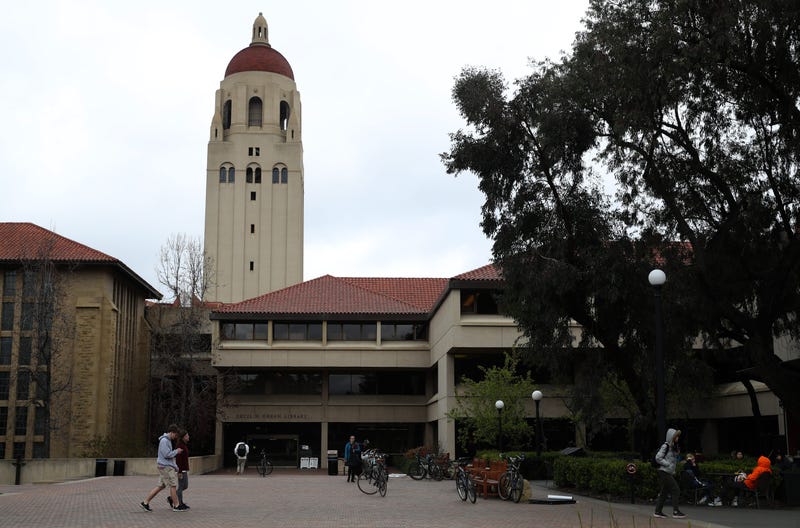 People walk by Hoover Tower on the Stanford University campus on March 12, 2019 in Stanford, California. 