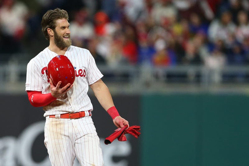 Bryce Harper, #3 of the Philadelphia Phillies, smiles after advancing to second base on a ball off the bat of J.T. Realmuto that was misplayed by third baseman J.D. Davis of the New York Mets, Citizens Bank Park on April 16, 2019.