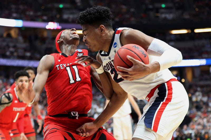 Rui Hachimura drives against Tariq Owens of Texas Tech in the 2019 NCAA Men's Basketball Tournament West Regional