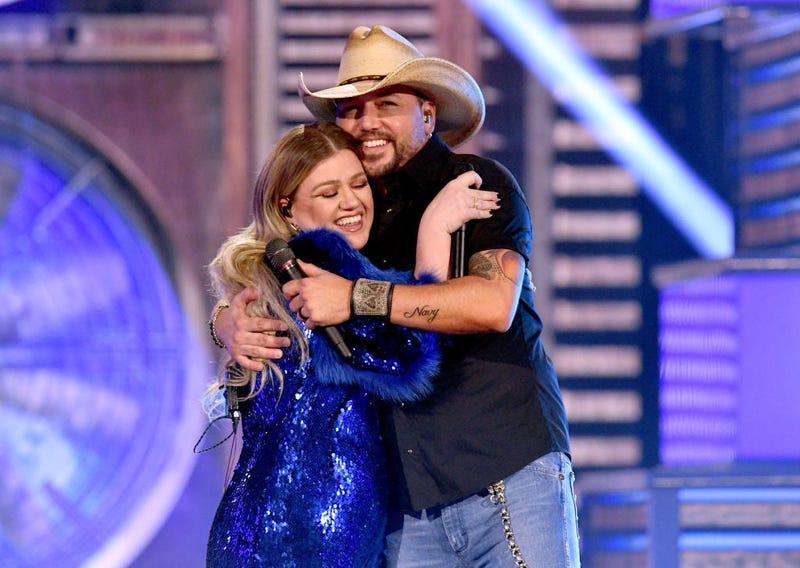 Kelly Clarkson and Jason Aldean perform onstage during the 54th Academy Of Country Music Awards at MGM Grand Garden Arena on April 07, 2019 in Las Vegas, Nevada.